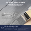 Eine Hand benutzt die plid Wetterschutz Holzfarbe, um Holz von grau auf weiß zu streichen. Der deutsche Text hebt die einfache Anwendung und die hochwertige, wetterfeste Deckkraft für den Innen- und Außenbereich der Marke plid hervor.