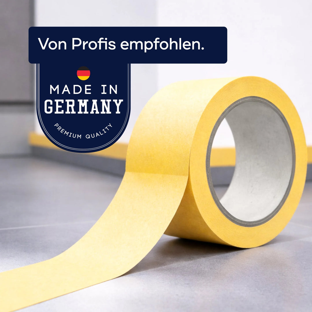 Eine Rolle Plid Goldband Malerkrepp aus dem PLID Shop liegt auf einer grauen Fläche. Auf dem Etikett steht "Von Profis empfohlen" und "Made in Germany" mit einer deutschen Flagge - Premiumband für exakte Farbkanten &amp; saubere Linien.